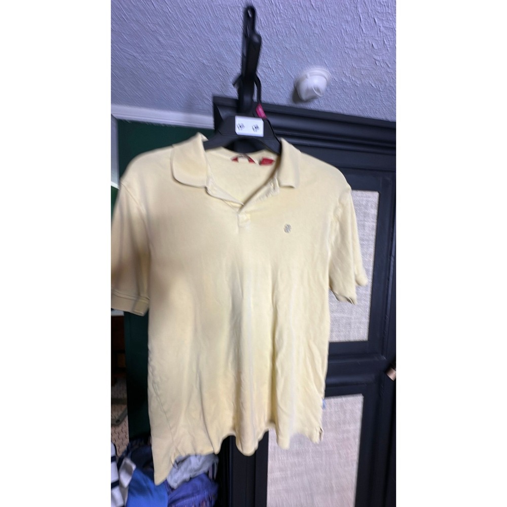 Izod lght yellow polo with silver logo size large 130